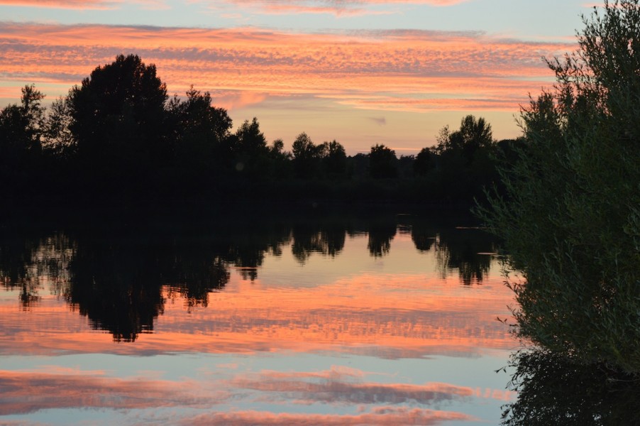 Sun set over the road lake