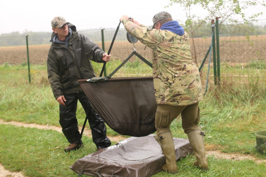 Demonstrating the correct way to use a weigh crook.