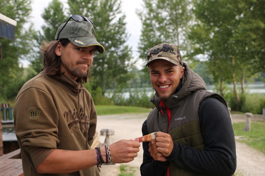 Jason loving taking the 10 euro winnings!!!.......Phil doesn't look chuffed !......