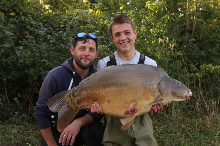 Young Freddie Bellinger with this 39lb 4oz Mirror.  Sharing the moment with his Dad.